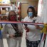 Two women cutting red white and blue ribbon