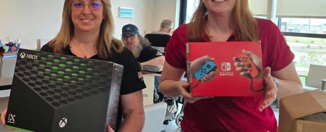 two women holding xbox