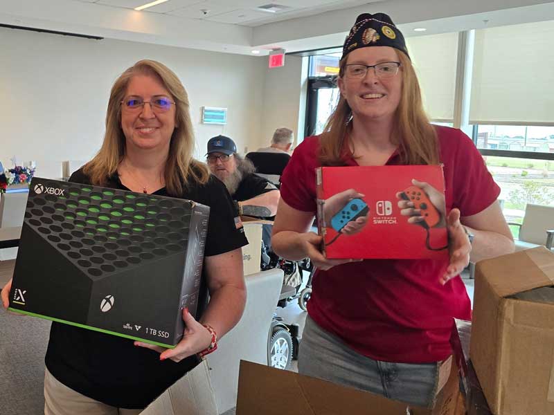 two women holding xbox